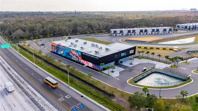 a view of swimming pool with outdoor seating and city view