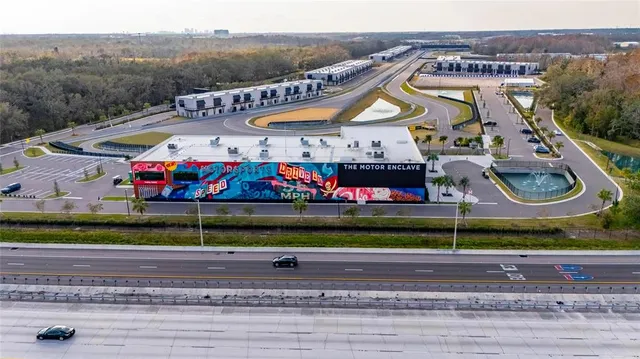 a view of a swimming pool with a patio and a swimming pool