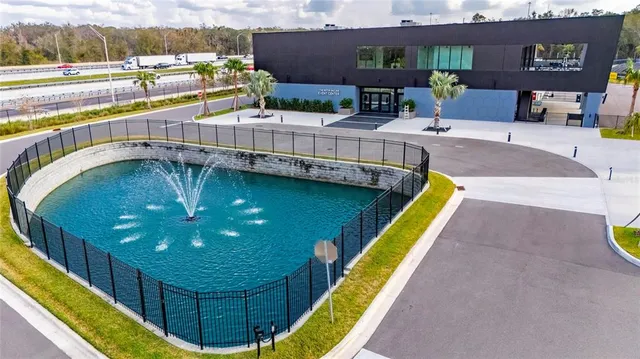 a view of a swimming pool with seating area