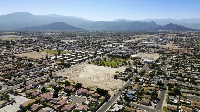 an aerial view of residential house and sandy dunes