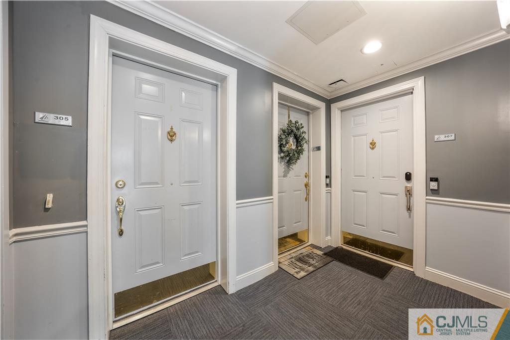 358 Rector Street, Unit 305 Perth Amboy, NJ 08861 - Photo 4 of 18 a view of a hallway with wooden floor