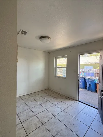 a view of an empty room and window