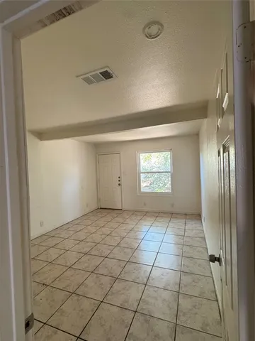 a view of an empty room and window