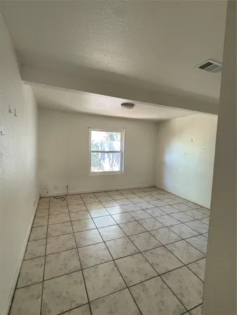 a view of an empty room and window