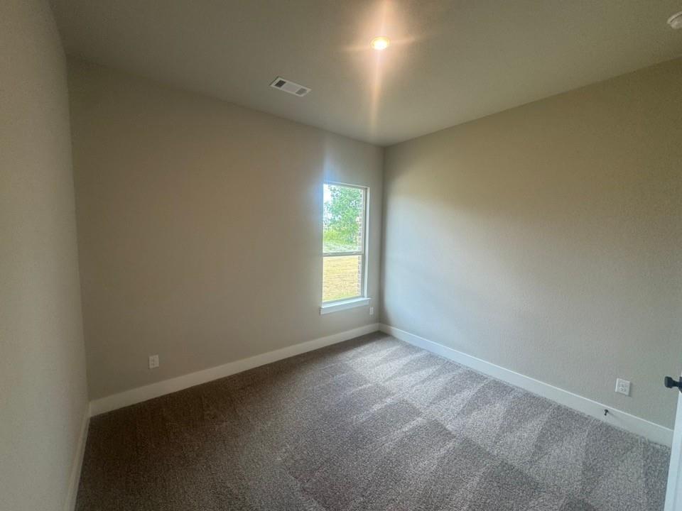 412 Indian Crk Road Van Alstyne, TX 75495 - Photo 20 of 24 an empty room with windows