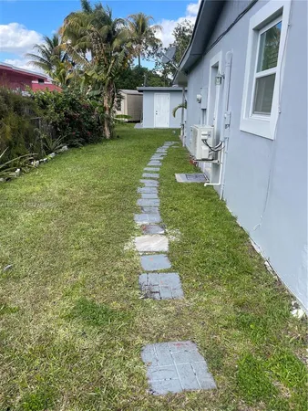a front view of a house with a yard and porch