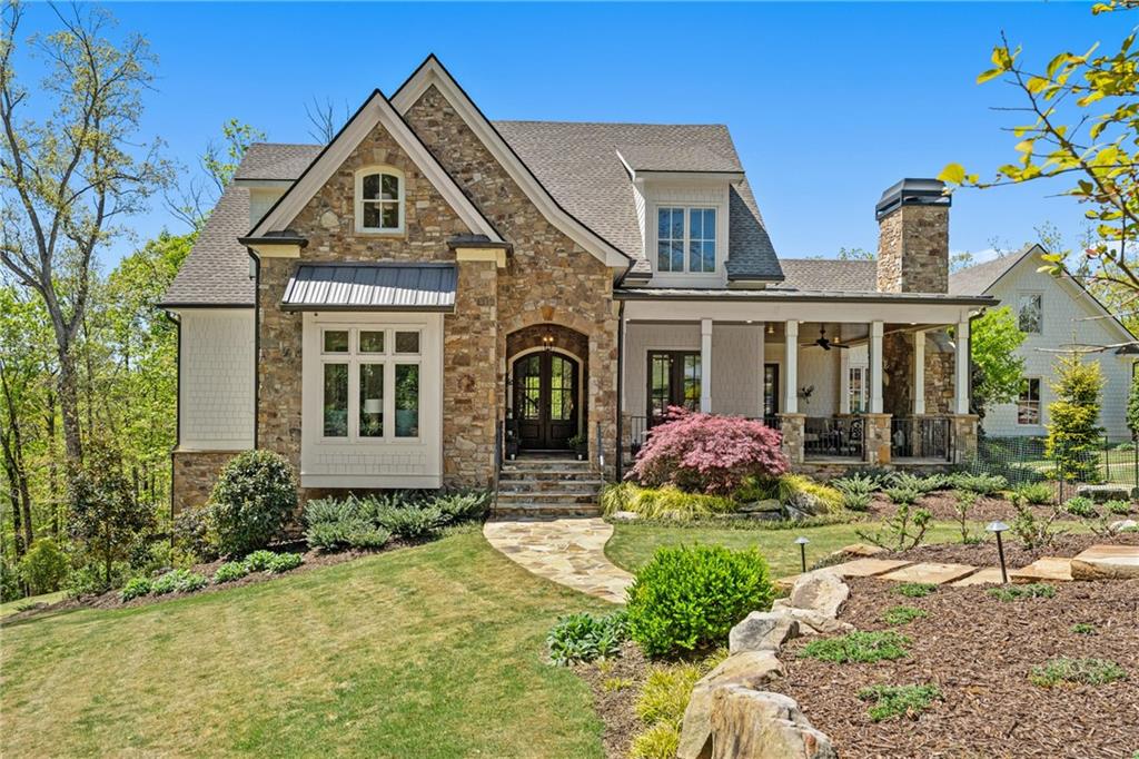 a front view of a house with garden