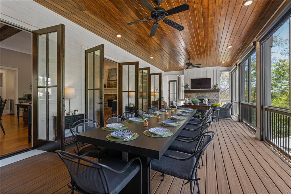 16200 Henderson Road Milton, GA 30004 - Photo 13 of 95 a view of a dining room with furniture window and wooden floor