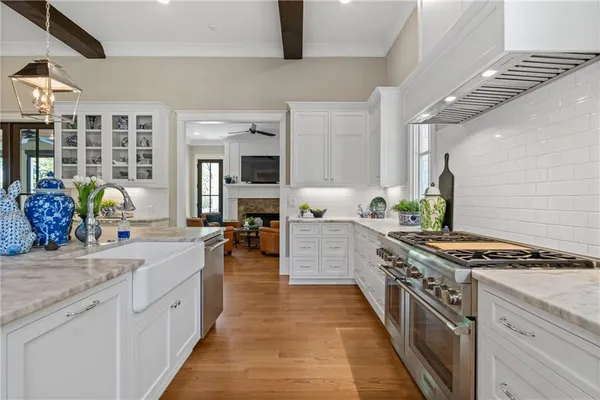 a spacious bathroom with a granite countertop sink mirror and a