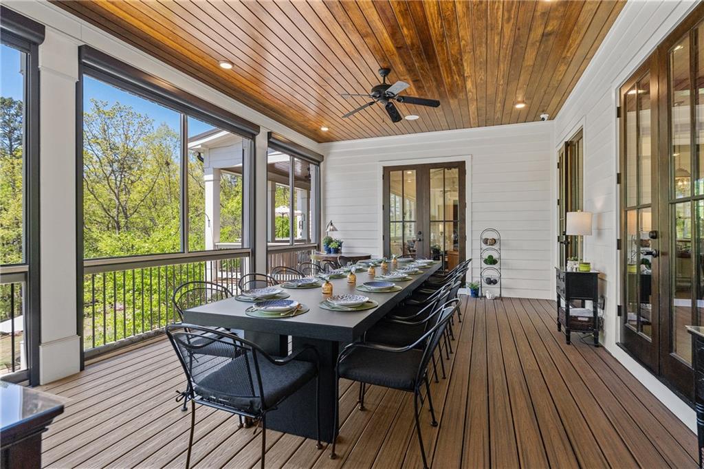 16200 Henderson Road Milton, GA 30004 - Photo 25 of 95 a view of a patio with table and chairs