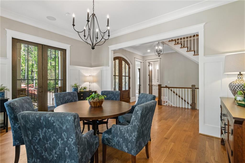 16200 Henderson Road Milton, GA 30004 - Photo 29 of 95 a view of a dining room with furniture window and wooden floor