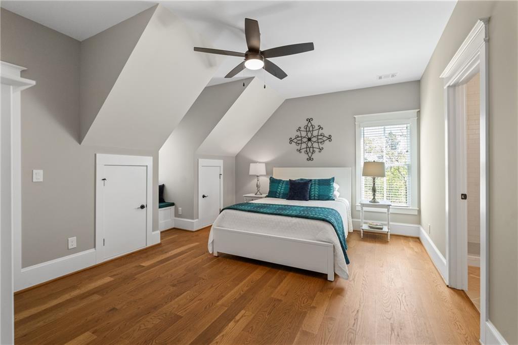 16200 Henderson Road Milton, GA 30004 - Photo 48 of 95 a bedroom with a bed chandelier and a window