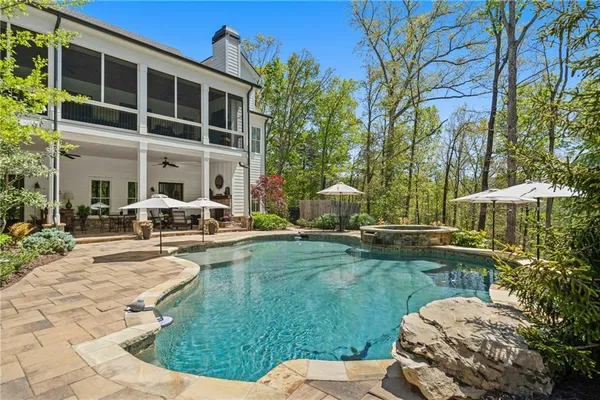 a front view of a house with plants