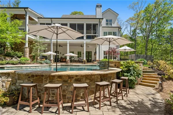 a outdoor space with patio furniture and a fireplace