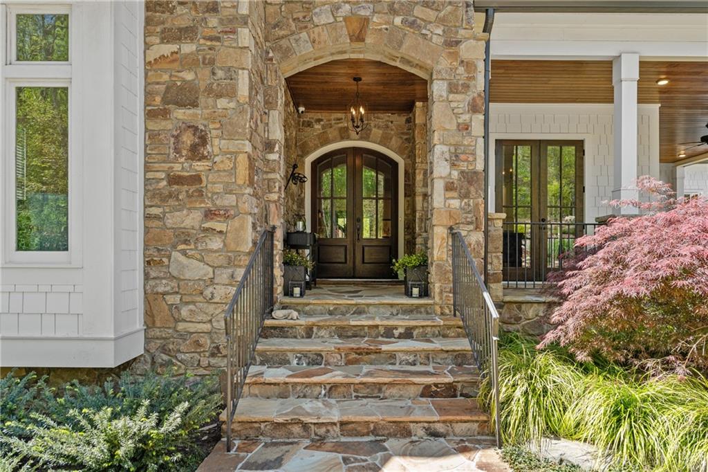 16200 Henderson Road Milton, GA 30004 - Photo 8 of 95 a front view of a house with plants