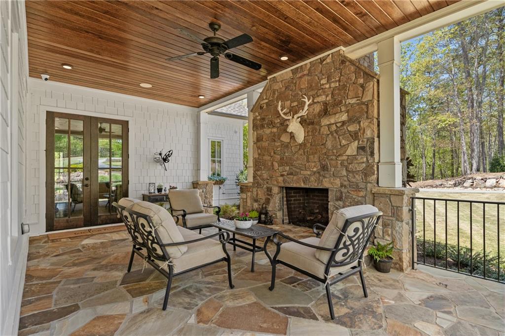 16200 Henderson Road Milton, GA 30004 - Photo 9 of 95 a outdoor space with patio furniture and a fireplace