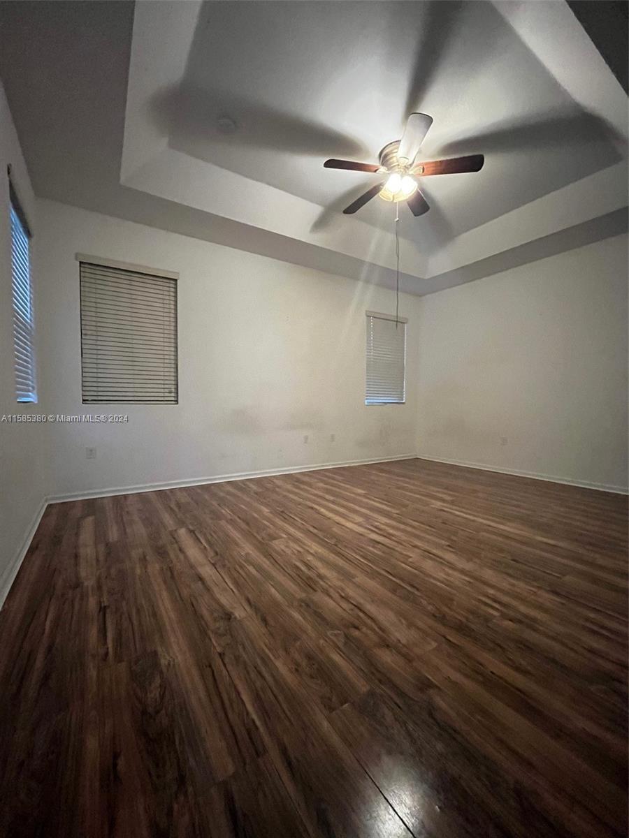 11879 Southwest 253rd Terrace Homestead, FL 33032 - Photo 14 of 26 wooden floor in an empty room