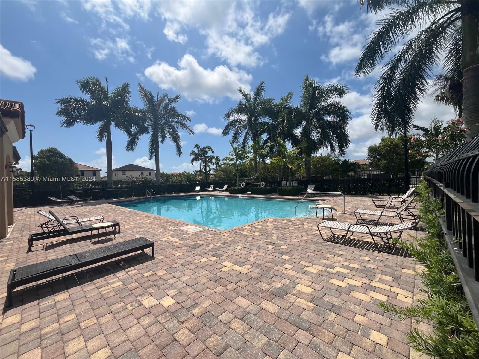 11879 Southwest 253rd Terrace Homestead, FL 33032 - Photo 24 of 26 a backyard of a house with lots of green space and lake view