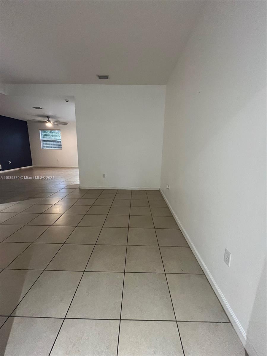 11879 Southwest 253rd Terrace Homestead, FL 33032 - Photo 5 of 26 a view of a livingroom with wooden floor and a sink