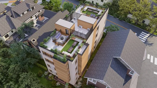 an aerial view of a house with a yard