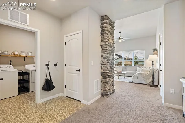 a room with furniture and white walls