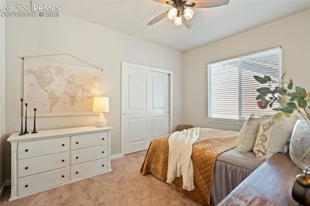 a bedroom with a bed and a dresser