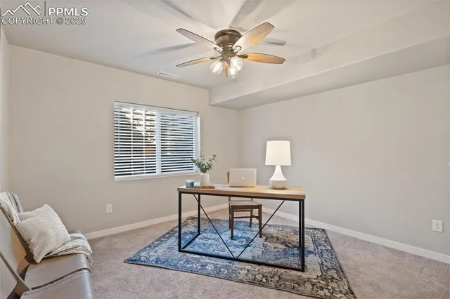 a workspace with furniture and a window