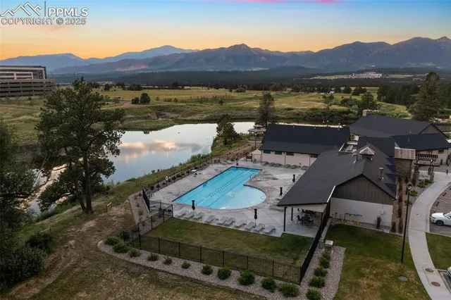 a view of a backyard with sitting area