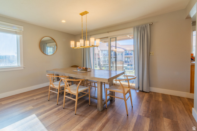 860 South Village Road, Unit Y8 St. George, UT 84770 - Photo 3 of 29 Dining space with light wood-type flooring and suspended lighting