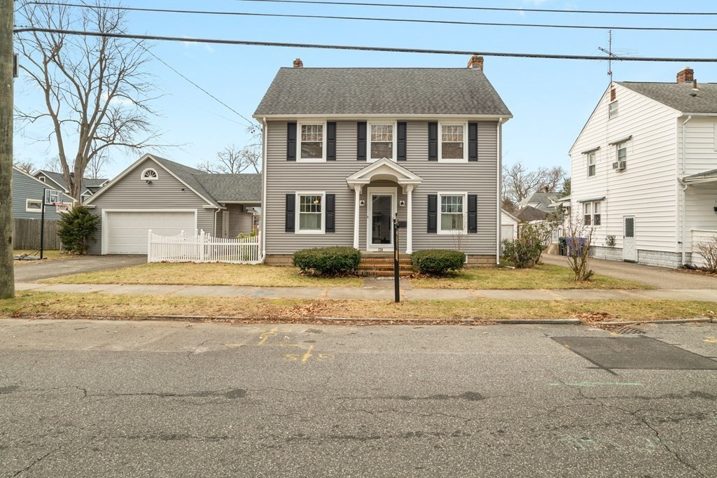 128 Shawmut Street Springfield, MA 01108 - Photo 1 of 39 a front view of a house with a yard