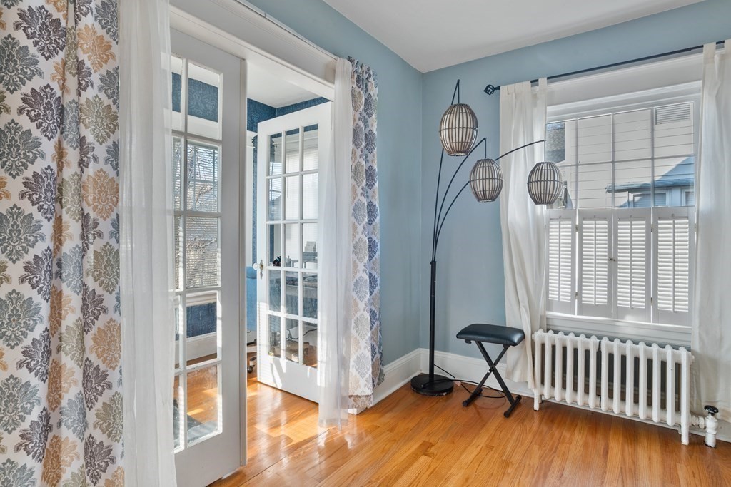128 Shawmut Street Springfield, MA 01108 - Photo 11 of 39 a view of staircase with wooden floor and windows