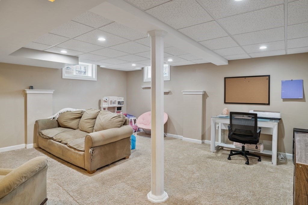 128 Shawmut Street Springfield, MA 01108 - Photo 20 of 39 a living room with furniture and a flat screen tv