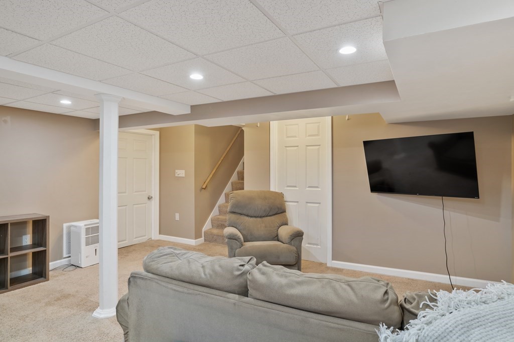 128 Shawmut Street Springfield, MA 01108 - Photo 22 of 39 a living room with furniture and a flat screen tv