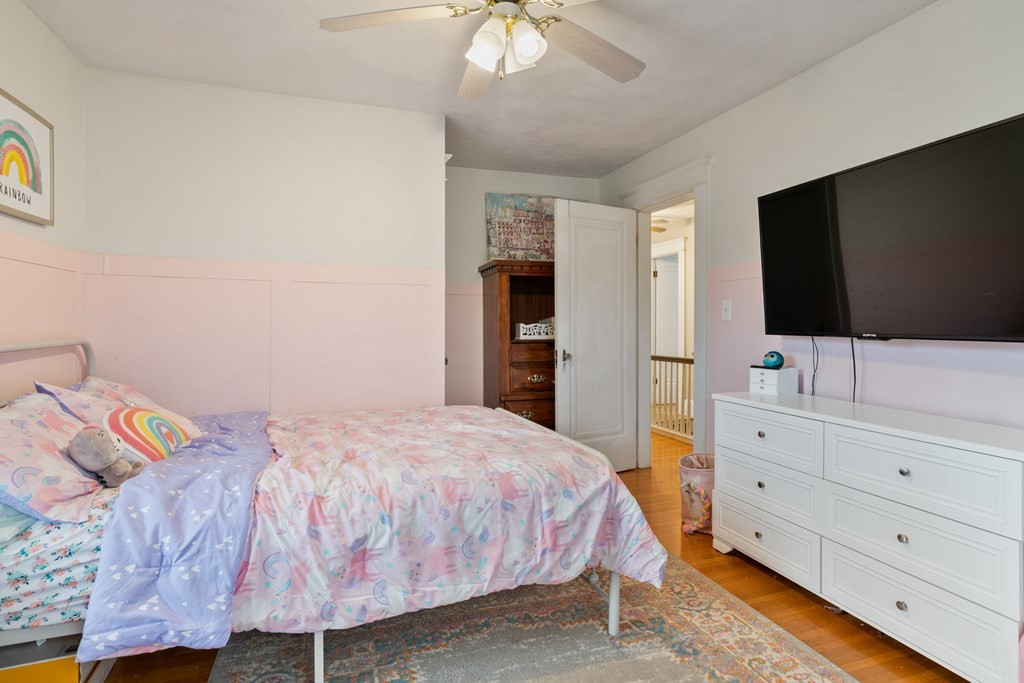 128 Shawmut Street Springfield, MA 01108 - Photo 25 of 39 a bedroom with a bed and a flat screen tv