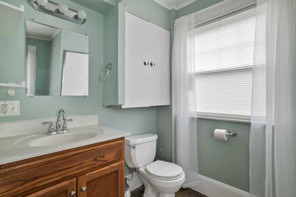128 Shawmut Street Springfield, MA 01108 - Photo 27 of 39 a bathroom with a sink a toilet and shower