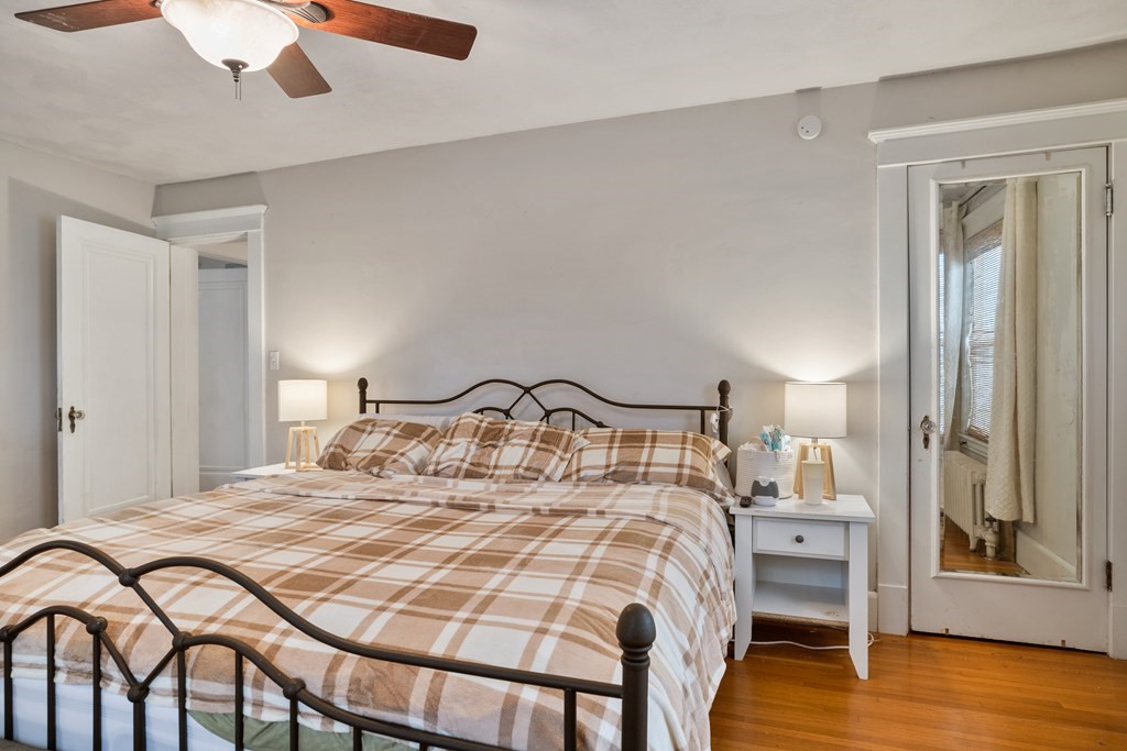 128 Shawmut Street Springfield, MA 01108 - Photo 30 of 39 a bedroom with a bed and a table