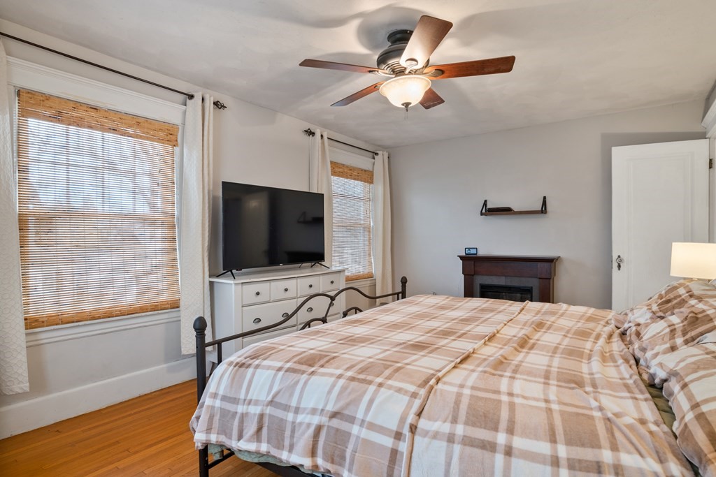 128 Shawmut Street Springfield, MA 01108 - Photo 31 of 39 a bedroom with a bed and a flat screen tv