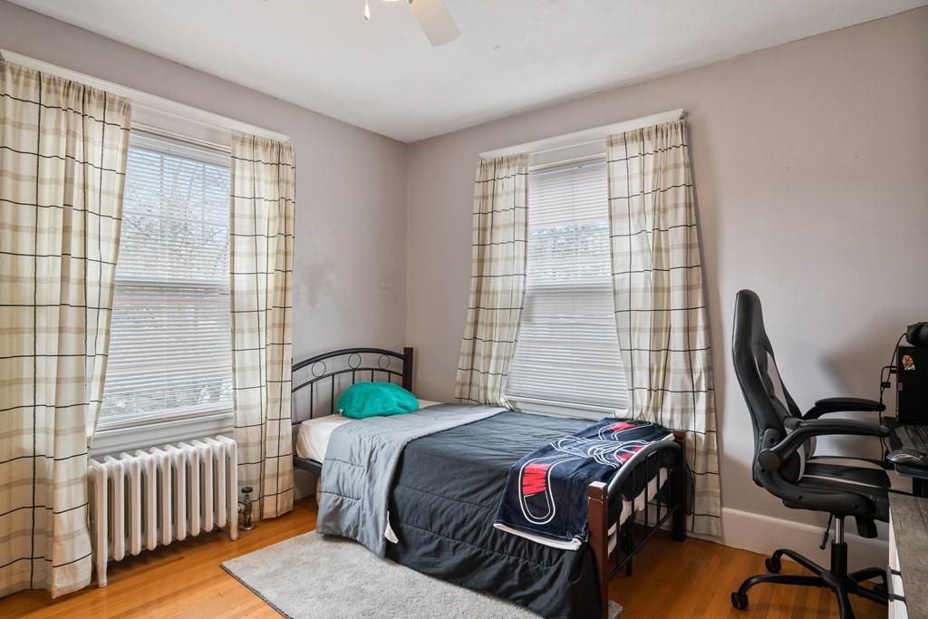128 Shawmut Street Springfield, MA 01108 - Photo 33 of 39 a bedroom with a bed and a window