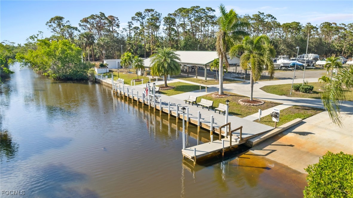 68 Sturbridge Lane Fort Myers, FL 33908 - Photo 11 of 23 a view of a swimming pool with a patio and a garden