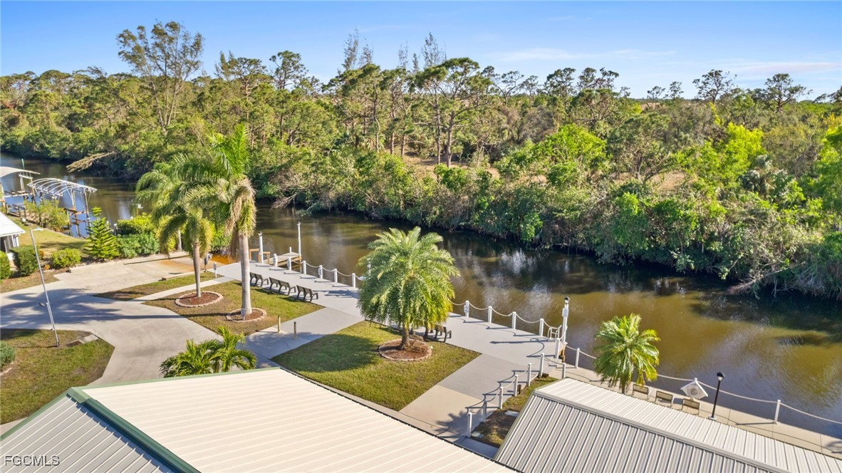 68 Sturbridge Lane Fort Myers, FL 33908 - Photo 12 of 23 a view of a lake with couches chairs