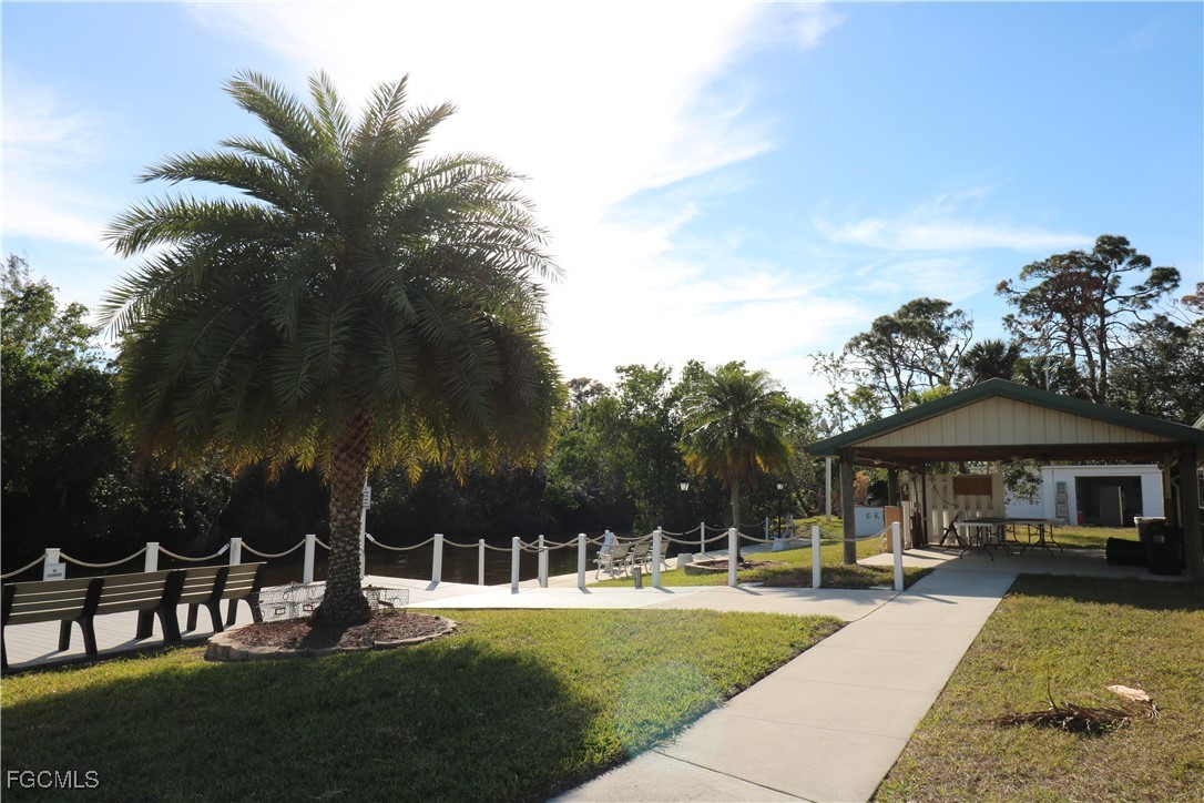 68 Sturbridge Lane Fort Myers, FL 33908 - Photo 19 of 23 a view of a house with swimming pool and sitting area
