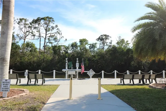 a view of a patio with a table and chairs