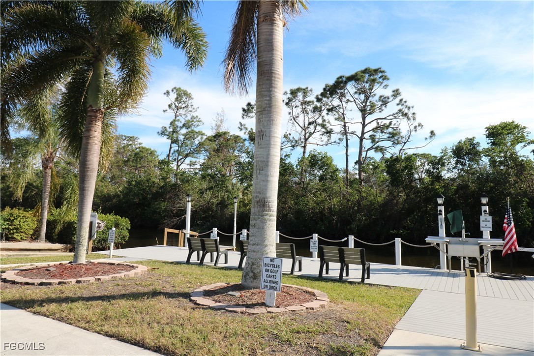 68 Sturbridge Lane Fort Myers, FL 33908 - Photo 22 of 23 a view of a patio with a table and chairs