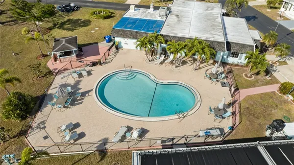 an aerial view of a house with a swimming pool