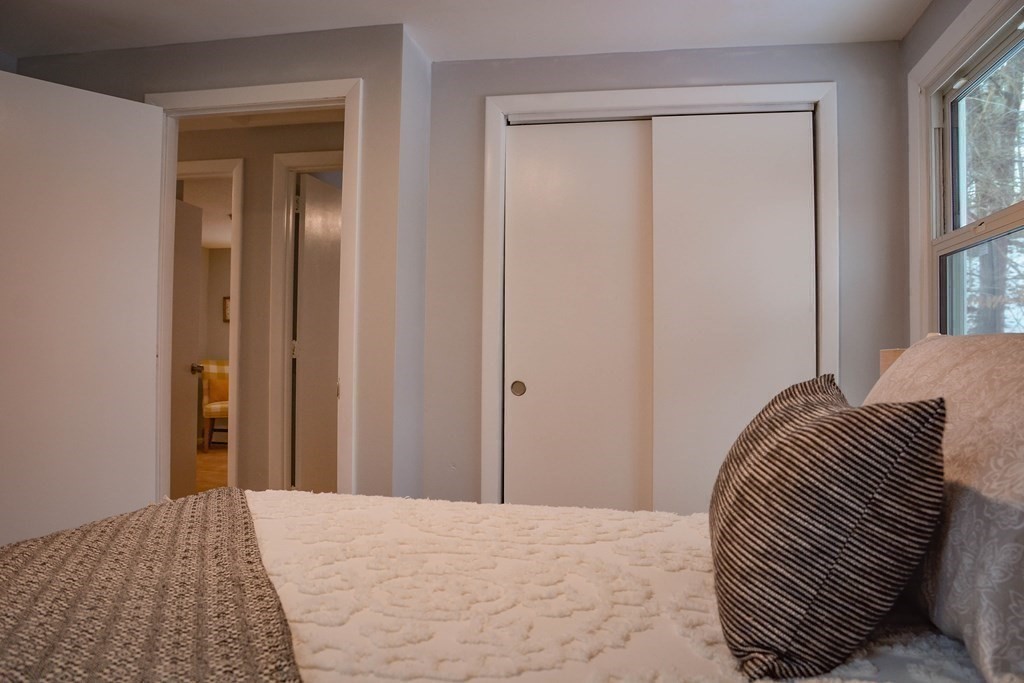144 Partridgeville Road Templeton, MA 01468 - Photo 17 of 33 a bedroom with a bed and a window