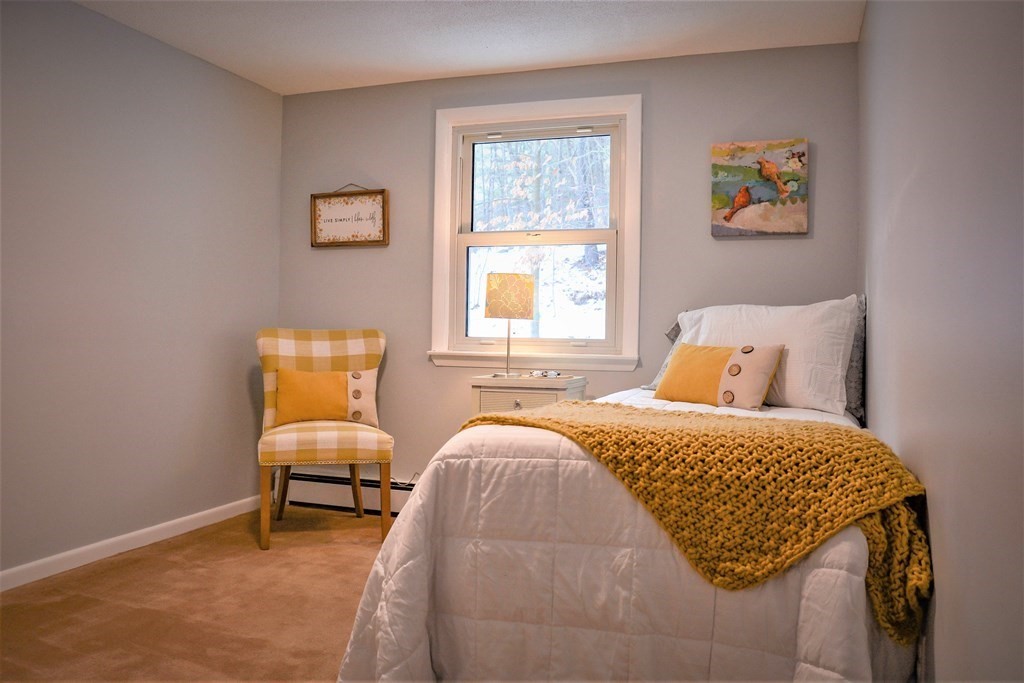 144 Partridgeville Road Templeton, MA 01468 - Photo 19 of 33 a bedroom with a bed and a couch