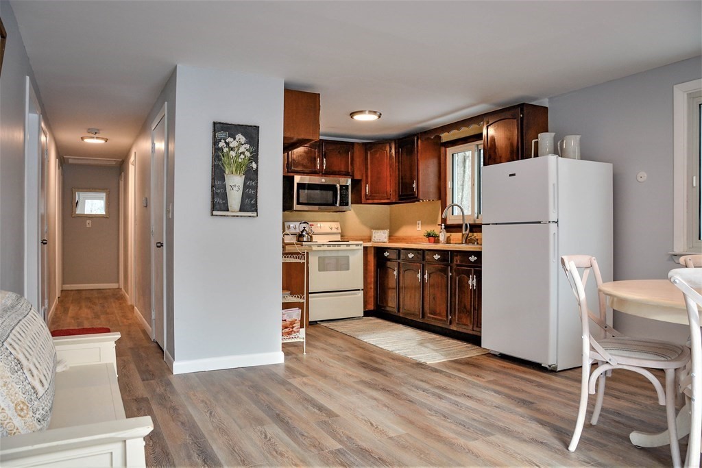 144 Partridgeville Road Templeton, MA 01468 - Photo 2 of 33 a kitchen with stainless steel appliances a refrigerator and a stove top oven