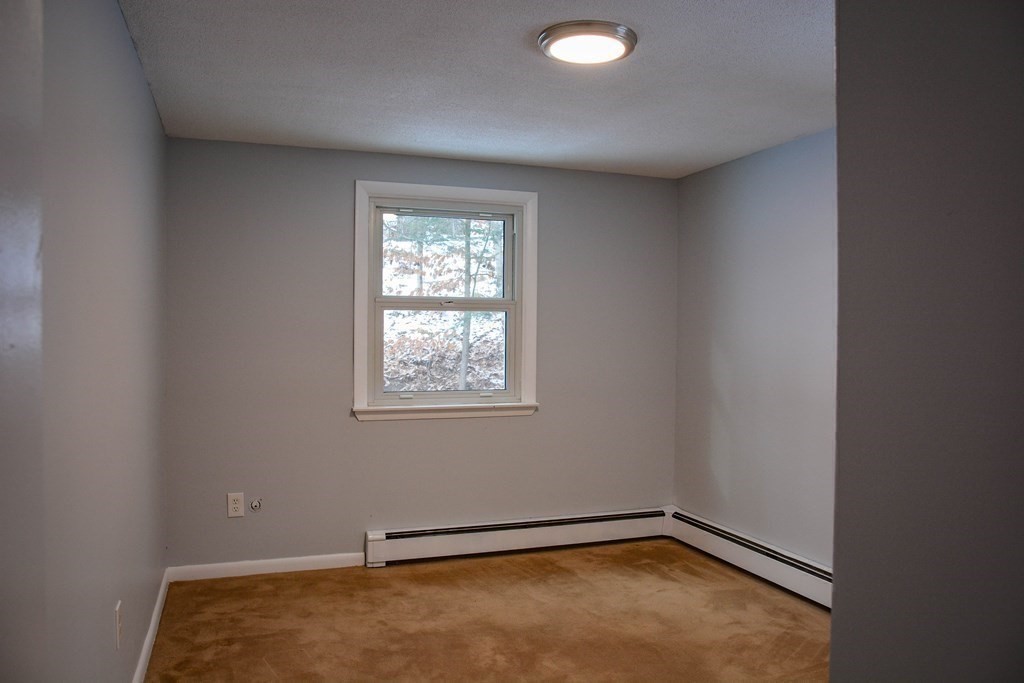 144 Partridgeville Road Templeton, MA 01468 - Photo 21 of 33 an empty room with a window