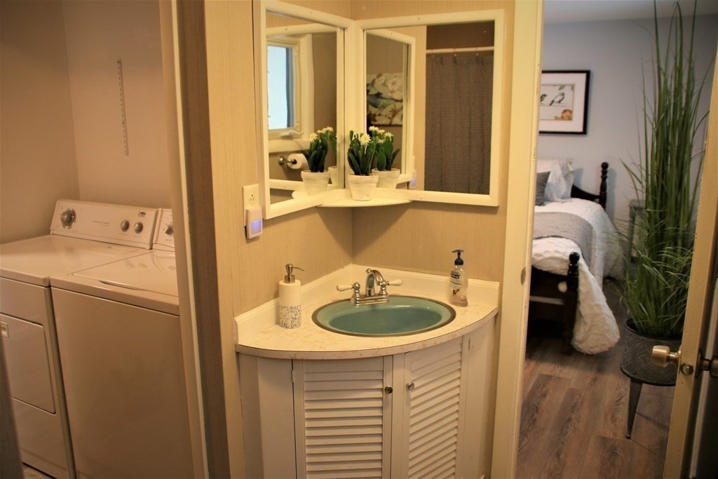 144 Partridgeville Road Templeton, MA 01468 - Photo 23 of 33 a room with sink and washing machine with wooden floor