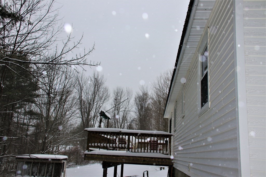 144 Partridgeville Road Templeton, MA 01468 - Photo 31 of 33 a view of a roof deck with wooden floor and fence